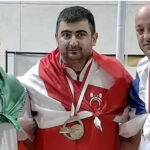 Iran bans weightlifter for life over handshake with Israeli