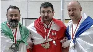 Read more about the article Iran bans weightlifter for life over handshake with Israeli